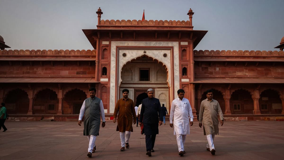 Figures entering a government building in Patna for political meetings regarding Bihar leadership changes.
