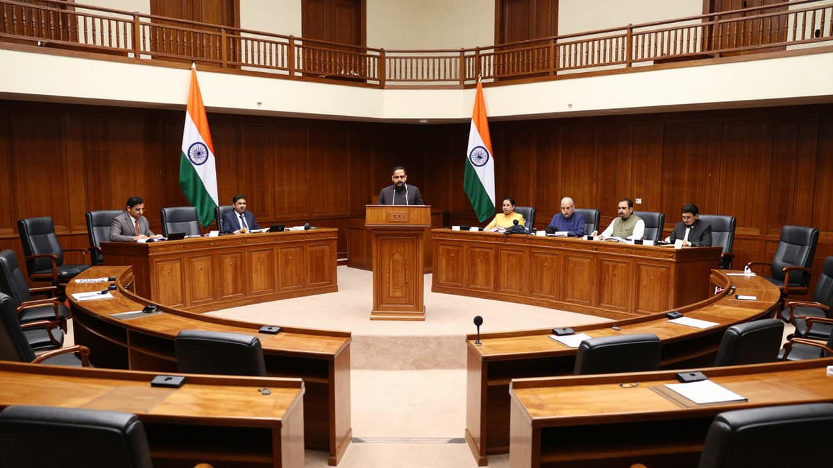 Interior of the Lok Sabha chamber showing the dais and desks during a legislative session on financial reform.