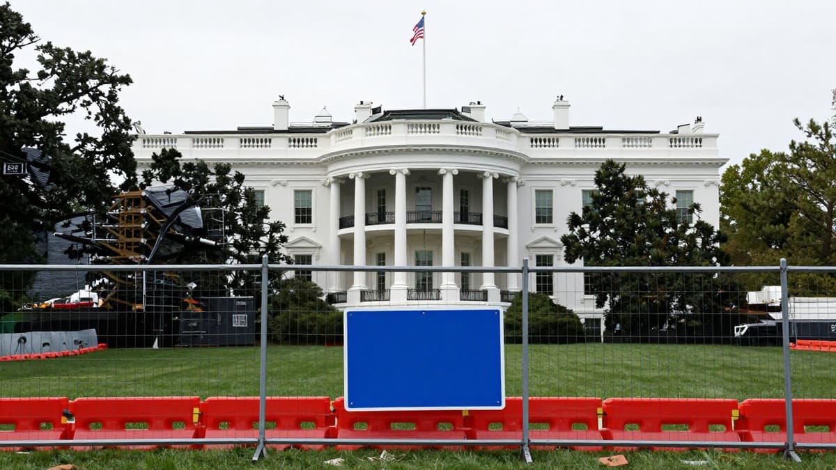 Construction barriers surrounding the White House East Wing site where the ballroom project has been halted.