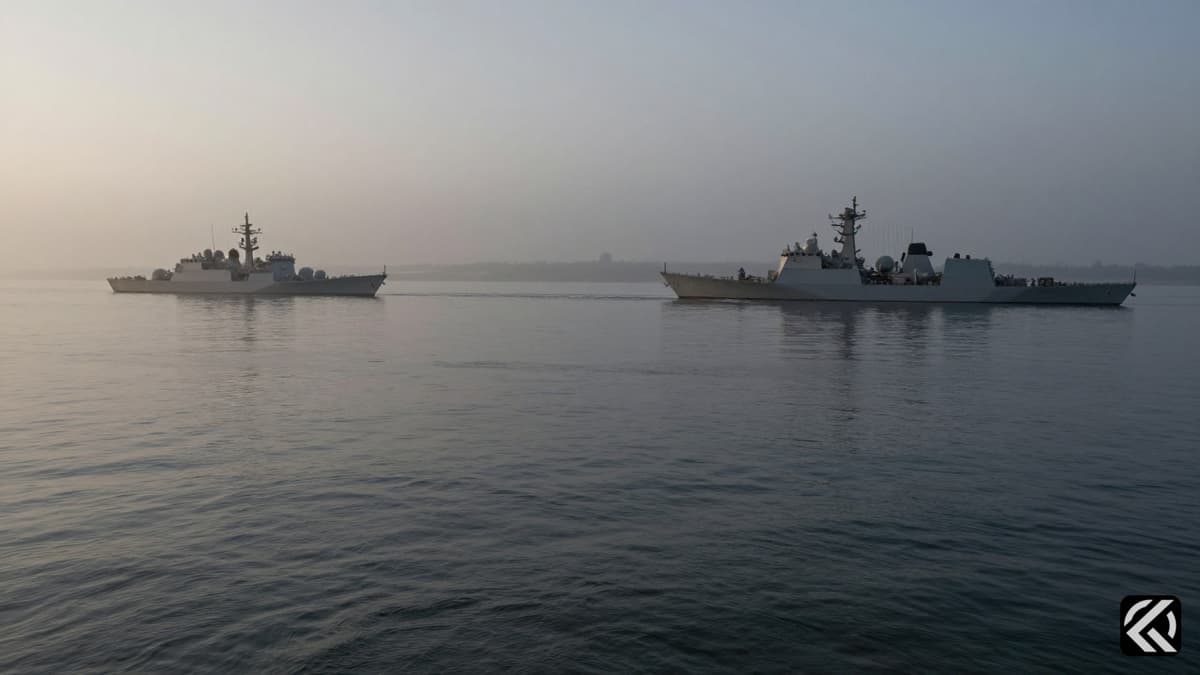Military vessels on the water in the Strait of Hormuz under foggy conditions.