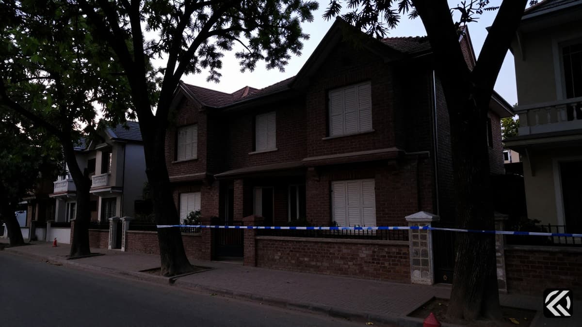 Darkened residential home in Kailash Hills with police tape indicating a crime scene in Delhi.