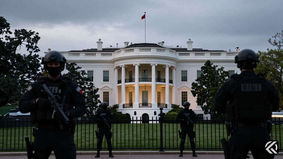 Secret Service agents securing the perimeter of the White House grounds after a security incident.