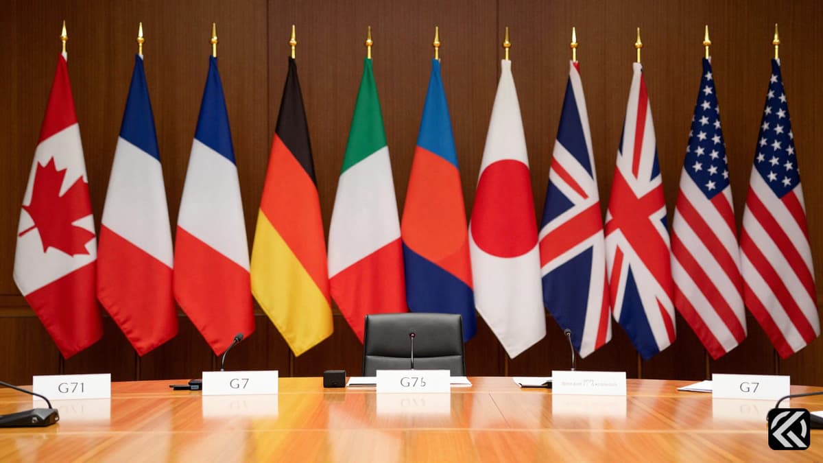 Formal diplomatic table with G7 nation flags at an international summit.