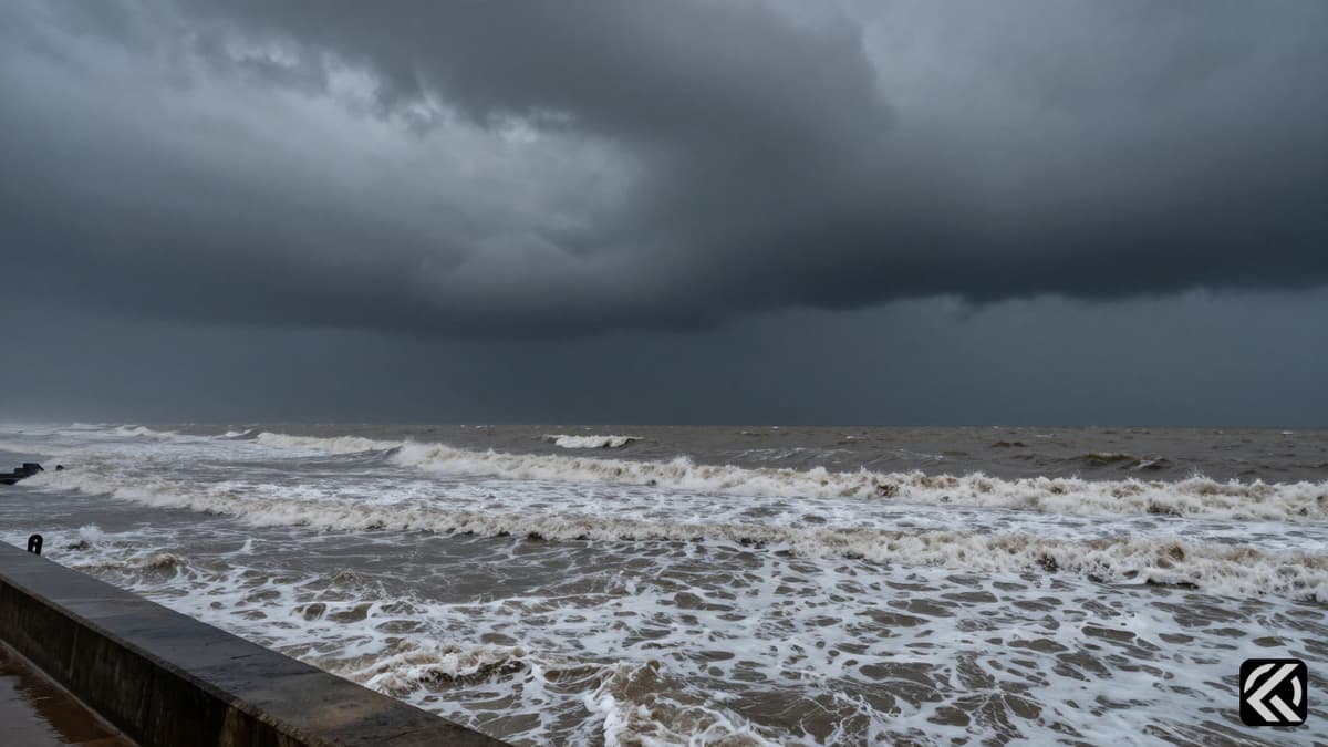 Stormy ocean waves crashing against a concrete barrier under dark, ominous grey clouds signaling severe weather.